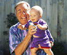 Photo of man holding grandchild